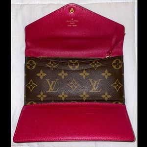 LOUIS VUITTON
MONOGRAM CANVAS EMILIE WALLET